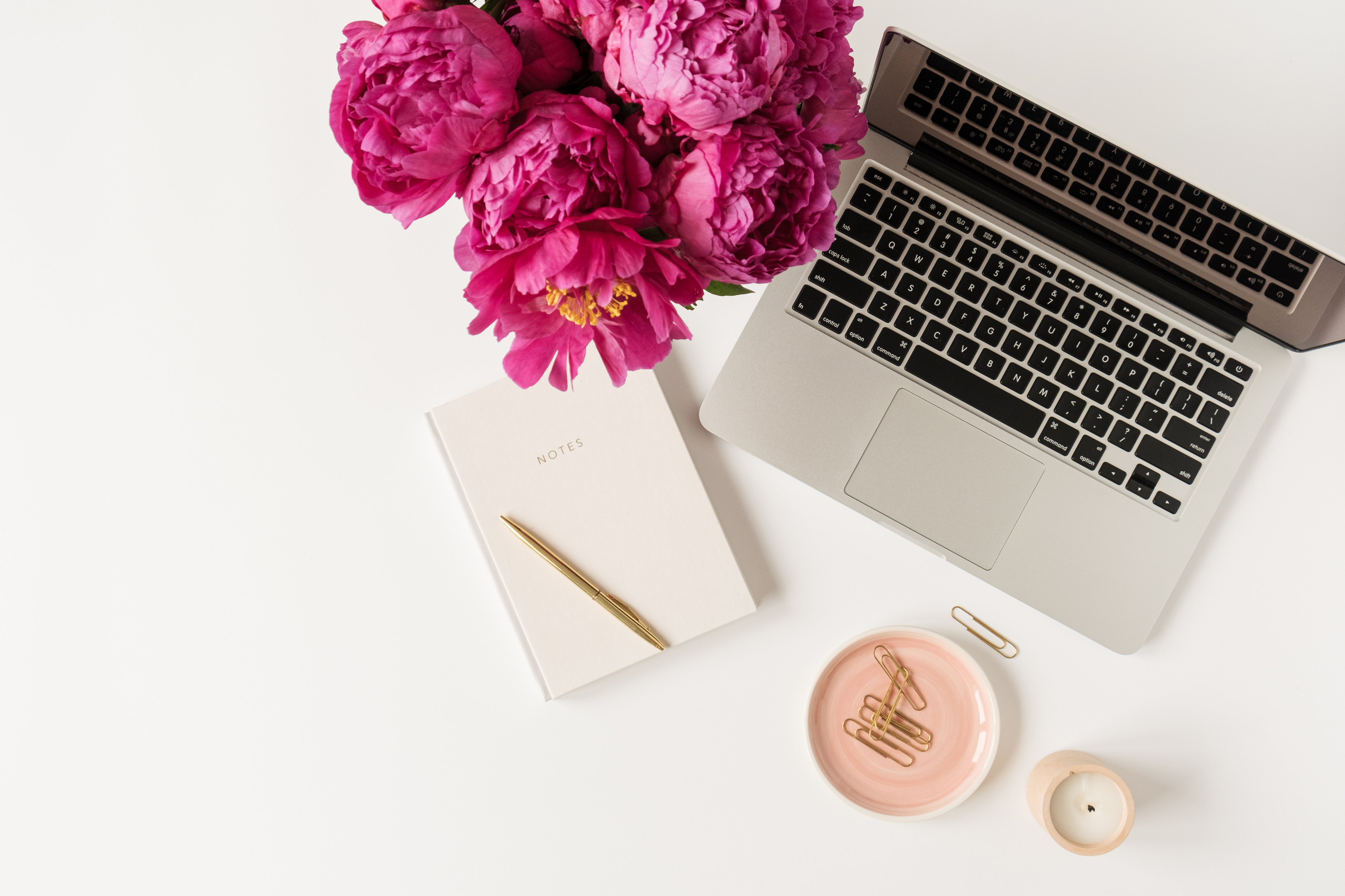 Flat Lay of Workspace with Bouquet of Flowers